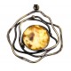 Brass necklace decorated with tracery ornaments and a clear lemon amber 