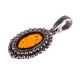 Silver pendant with amber "The Blow of the Wind"