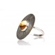Blackened silver ring with landscaped amber 