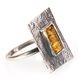Forged silver ring with lemon-colour amber