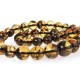 Gently polished, yellow amber beads with soil impurities