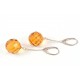 Silver earrings with round-diamond polished amber
