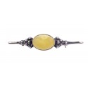 Silver brooche with yellow amber