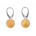 Silver earrings with round yellow amber