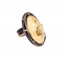Brass ring with white Baltic amber